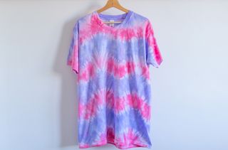 A t-shirt tie dyed with a chevron stripe