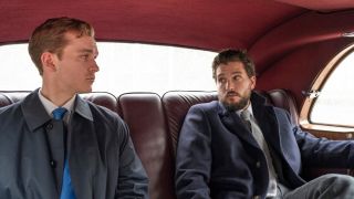 Robert and Henry sitting in the back of a car in Industry season 3