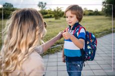 child greeted by his mum