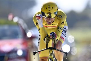 Team UAE Emirates Tadej Pogacar of Slovenia wearing the overall leaders yellow jersey crosses the finish line during the 20th stage of the 108th edition of the Tour de France cycling race a 30 km time trial between Libourne and SaintEmilion on July 17 2021 Photo by AnneChristine POUJOULAT AFP Photo by ANNECHRISTINE POUJOULATAFP via Getty Images