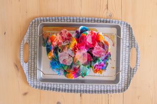 Ice melting in a tray to tie dye a t-shirt