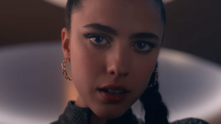 Margaret Qualley looking into camera in The Substance