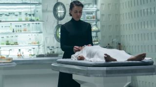 Olivia Williams stands somberly over Chloe Lea lying on a medical table in Dune: Prophecy S1 E3 - "Sisterhood Above All."