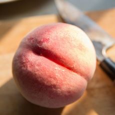 Brazilian Butt Lift: Peach on a chopping board