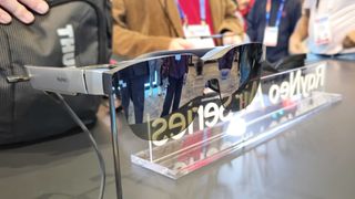 The RayNeo Air 3 glasses on a stand at CES