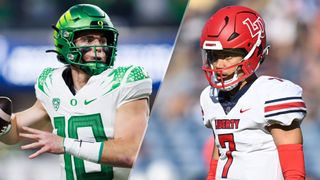 Bo Nix #10 of the Oregon Ducks / Liberty Flames quarterback Kaidon Salter (7) 