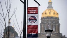 A caucus banner in front of the Iowa capitol