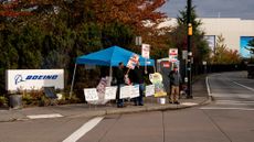 Workers picket outside the Boeing factory in Renton, Washington, on Oct. 22, 2024.