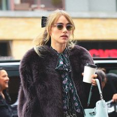 Suki Waterhouse wearing a faux fur jacket