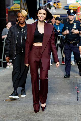 lily collins in a burgundy suit