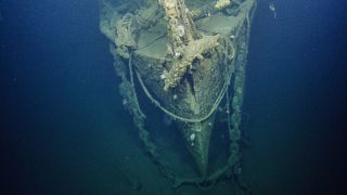 Researchers dive to the wreck of the WW II-era aircraft, the USS Independence.