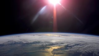 A rising sun and Earth&#039;s horizon are featured in this image photographed by an Expedition 13 crewmember on the International Space Station.