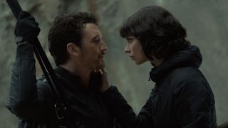 Miles Teller and Anya Taylor-Joy looking at each other in "The Gorge,"