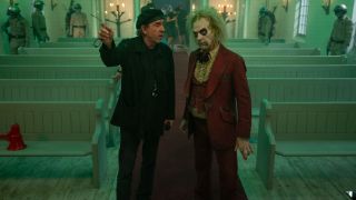 Tim Burton directs a costumed Michael Keaton on the set of Beetlejuice Beetlejuice.