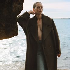 Model wearing clothing sold at net-a-porter by the sea