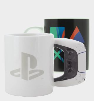 Two PlayStation mugs beside one another, against a plain background