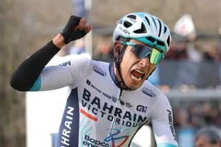 Bahrain Victorious's Colombian cyclist Santiago Buitrago celebrates as he crosses the finish line to win the 4th stage of the Paris-Nice cycling race, 183 km between Chalon-sur-Saone and Mont Brouilly, on March 6, 2024. (Photo by Thomas SAMSON / AFP)