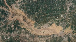 The flooded Kabul River, as seen by a satellite operated by San Francisco-based company Planet on Aug. 28, 2022.