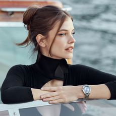 Barbara Palvin wears a new Longines watch with a blue dial on a boat 