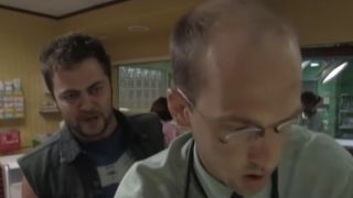 Nick Offerman standing behind Anthony Edwards on ER