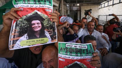 Mourners carry the body of U.S.-Turkish protester Aysenur Eygi in the West Bank