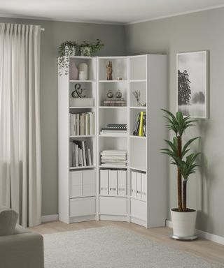 corner shelf storage in a light green living room