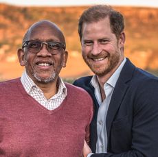 Prince Harry and Prince Seeiso of Lesotho smiling in front of a mountain