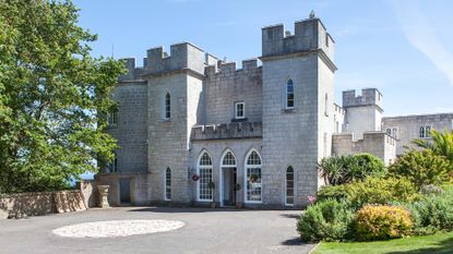 The exterior of the Penn Castle Estate in Dorset with uninterrupted views of the dramatic Jurassic coast