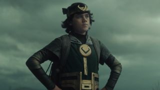 Jack Veal as Kid Loki standing with hands on hips in The Void