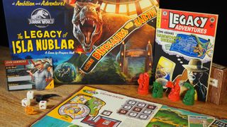 Jurassic World: The Legacy of Isla Nublar box, board, tokens, cards, booklets, and icons on a wooden table