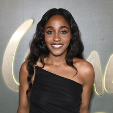 Ayo Edibiri attends the Walt Disney Company Post-Emmys® Celebration on September 15, 2024 in Los Angeles, California wearing a one-shoulder black dress.