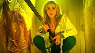 Best Amazon Prime horror movies: Kiernan Shipka as Jamie Hughes holding a bat and a wrench during the movie Totally Killer. 