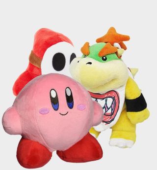 Kirby, Bowser Jr., and Shy Guy plush toys against a plain background