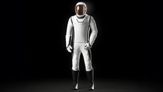 A white spacesuit with black boots standing in a black space.