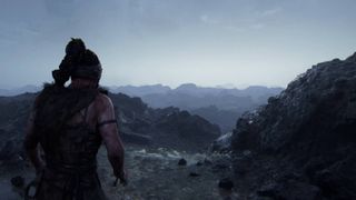 Senua's Saga Hellblade 2 screenshot of Senua looking at rocky mountains