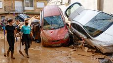 Valencia residents begin the huge job of cleaning up in the wake of devastating floods