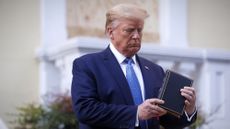 Donald Trump holds a Bible