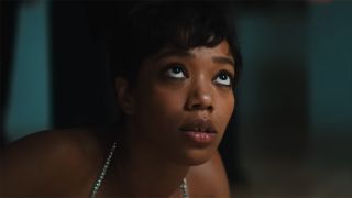 Naomie Ackie gets helped up from the floor in the Blink Twice trailer.