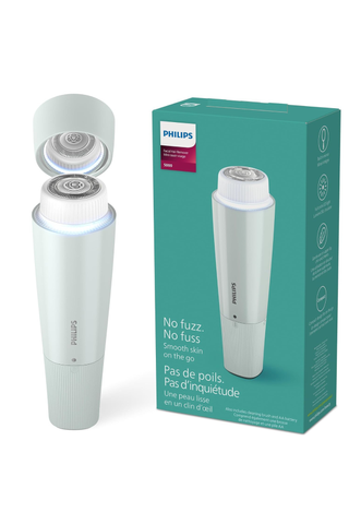 Philips facial hair remover beside its box on a white background