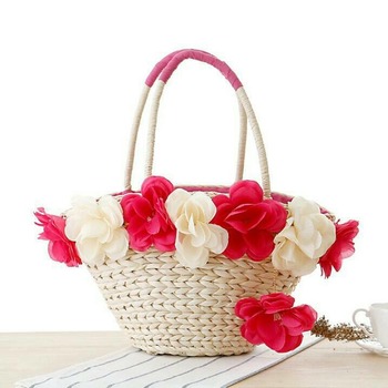 Woven petite handbag with decorative flowers