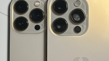 Two iphones with one place near the edge of the other