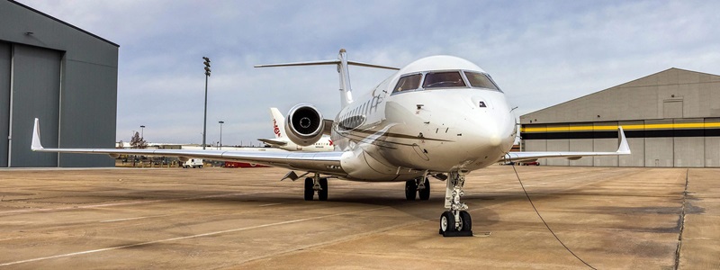 airplane in front of hangar