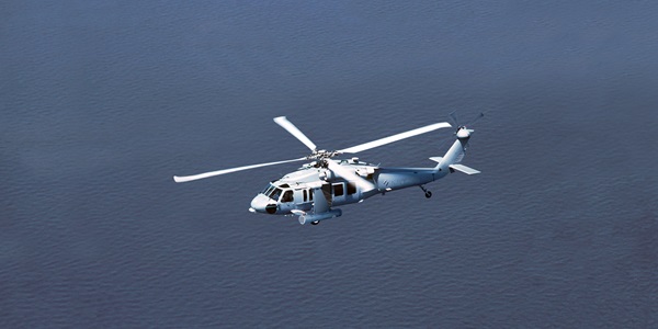 helicopter flying over the sea