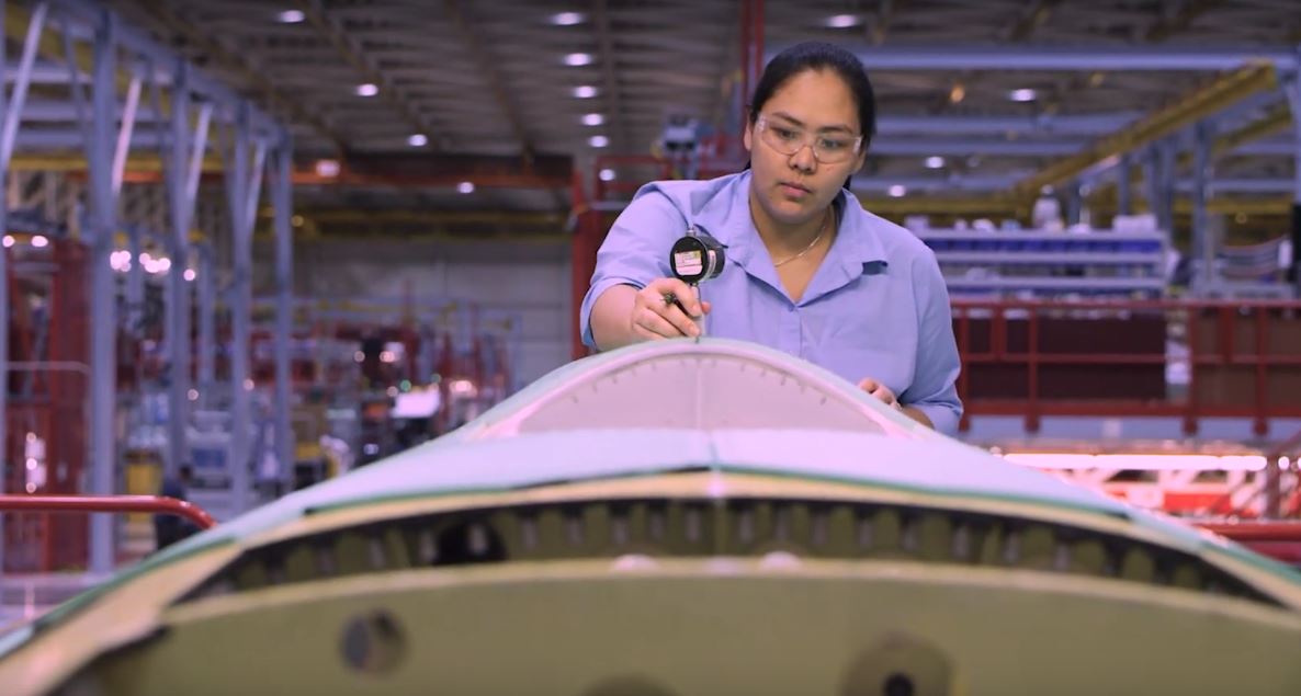 Woman working in a manufacturing setting.