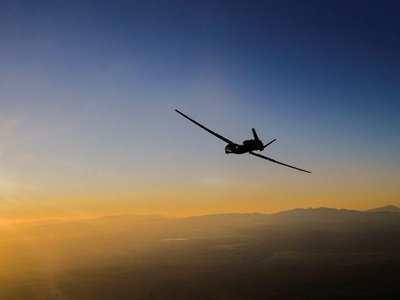 silhouette of military plane at sunset