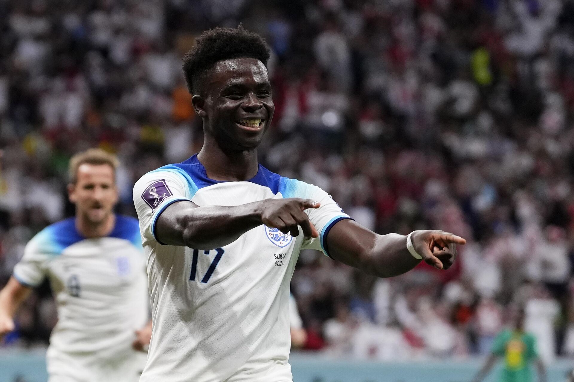 O inglês Bukayo Saka celebra após marcar o terceiro gol da Inglaterra contra Senegal na Copa do Mundo do Catar, em Al Khor, 4 de dezembro de 2022 - Sputnik Brasil, 1920, 04.12.2022