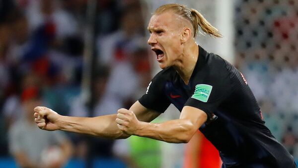 Soccer Football - World Cup - Quarter Final - Russia vs Croatia - Fisht Stadium, Sochi, Russia - July 7, 2018 Croatia's Domagoj Vida celebrates their first goal scored by Andrej Kramaric - Sputnik Brasil