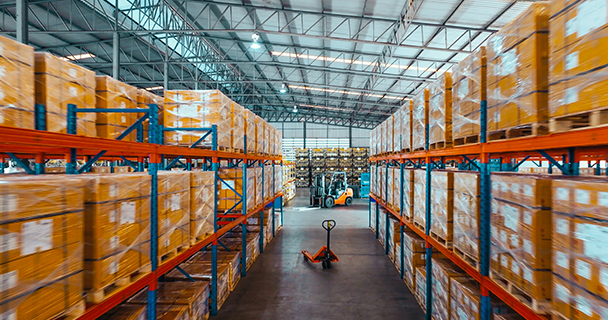 Inventory stacked on shelves inside a warehouse 