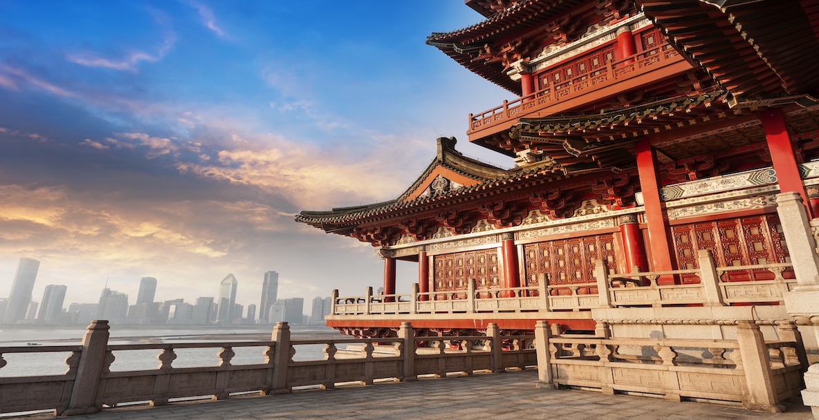 An image of a Chinese landmark with China's cityscape in the distance