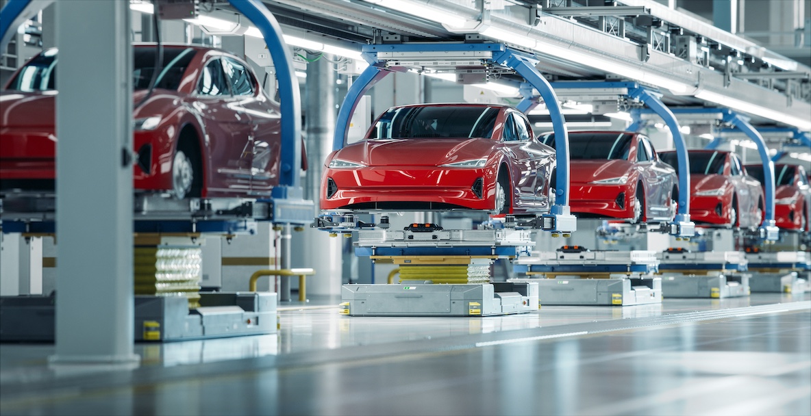 An image of EVs on a manufacturing production line